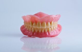 Are Dentures Worth It? Benefits Compared to Dental Implants and Bridges